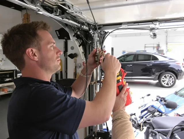Maple Heights Garage Door Repair safety certified technician performing cable replacement in Maple Heights