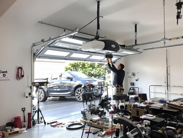 Maple Heights Garage Door Repair specialist installing smart garage door opener system in Maple Heights home