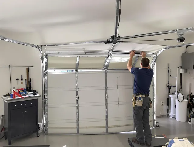 Maple Heights Garage Door Repair specialist performing precise section replacement on Maple Heights garage door